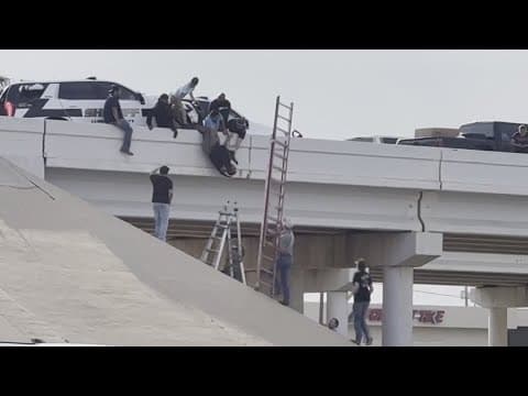 Texas deputy rescued after dangling from overpass in crash