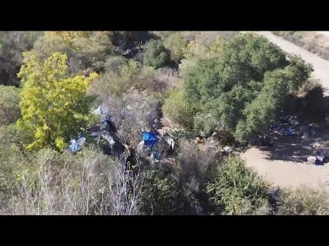 What's being done about the homeless encampments along Escondido's creek bed?