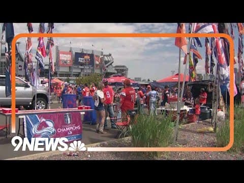 Fans cheer on the Broncos at the home opener