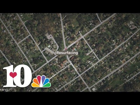 Crews resurfacing road on Cedar Lane