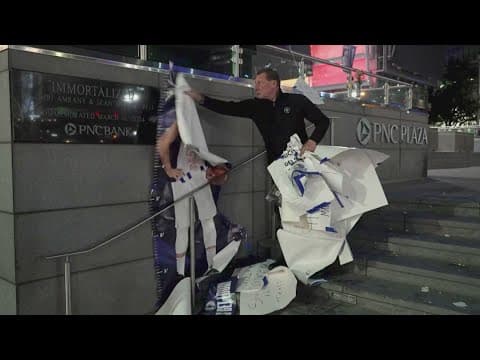American Airlines Center security staff clears away memorial left by fans after Luka Doncic trade