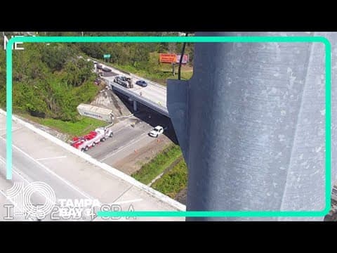 Woman hospitalized after semi-truck's trailer falls from overpass, hitting her Jeep