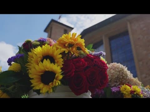 Volunteers work to keep Annunciation Church memorial growing as donations, flowers flow in
