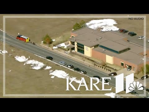 Procession escorts slain police officers back to Wisconsin