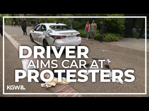Driver rolls toward protesters on Portland State University camps, launching pepper spray