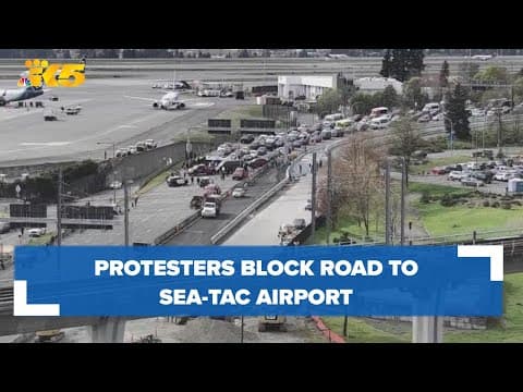 Protesters block road to Sea-Tac Airport