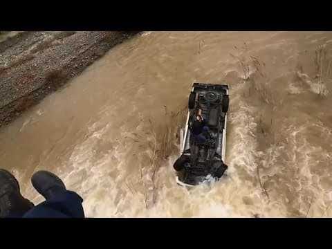 Video shows woman rescued after California Highway Patrol said she was stuck on submerged car