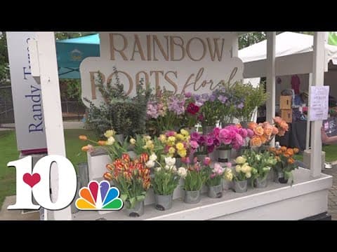 Katie Inman smelling the flowers at Dogwood Arts Festival