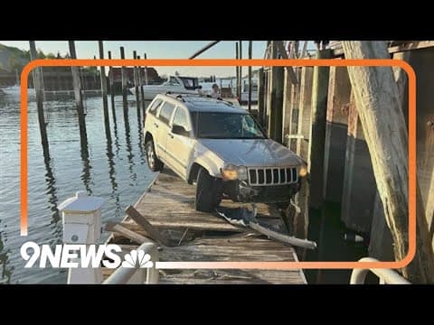 SUV driver goes off pier, lands on dock