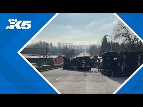 Semi-truck rolls, loses load of aluminum on I-5 off-ramp in Seattle