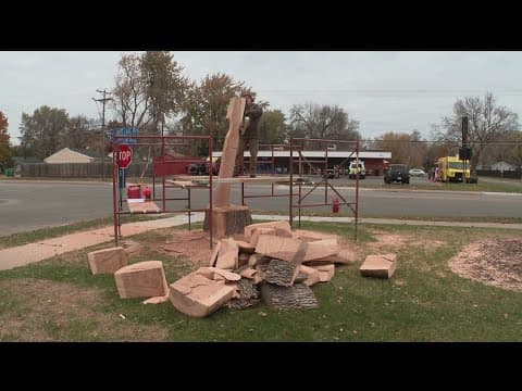 Artist carves giant toothbrush for New Hope dental clinic