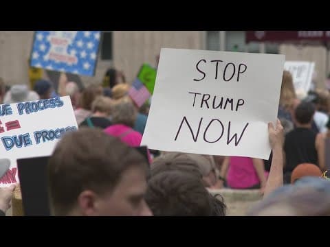 Protesters rally against President Trump's policies in downtown Houston