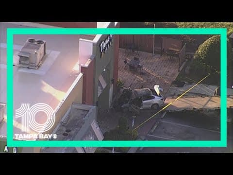 Driver hospitalized after crashing into Wesley Chapel Panera Bread, car catches fire