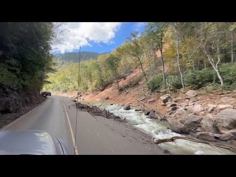 Roads crumbled, debris in rivers and vehicles navigate damaged roads in North Carolina