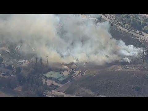 Brush fire threatens homes in Poway amid Red Flag Warning