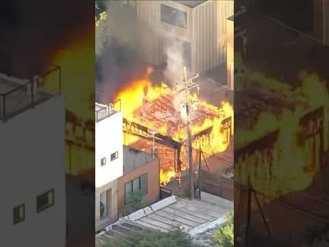 Firefighters Battle Garage Fire