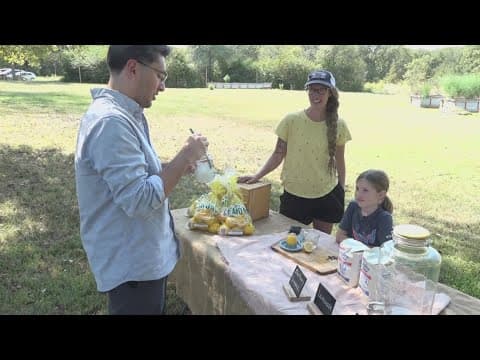 Mother and daughter from Van, Texas, squeezing lemons for hurricane relief