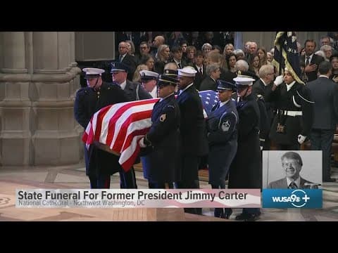 Jimmy Carter's casket is brought into state funeral service at National Cathedral