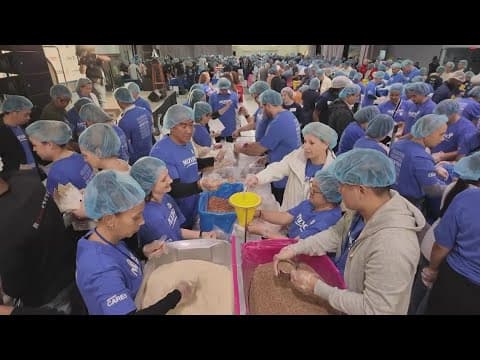 Thousands of volunteers preparing meals for New Yorkers as part of 9/11 National Day of Service