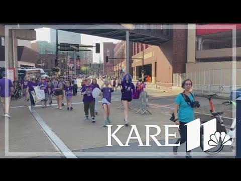 Walk To End Alheimer's turns Minneapolis streets purple