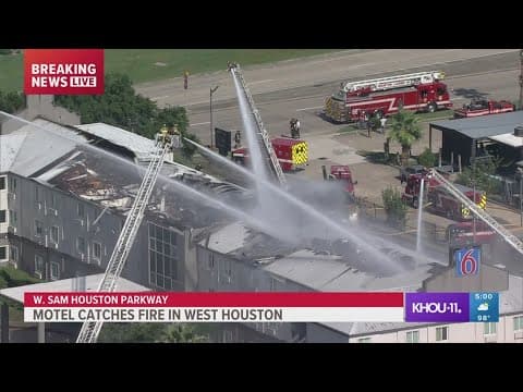 Firefighters work more than an hour to extinguish motel fire in west Houston