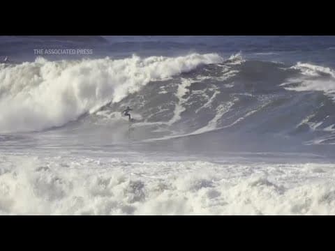 Surfers compete on powerful waves of over 13 feet in Brazil's Itacoatiara Big Wave event