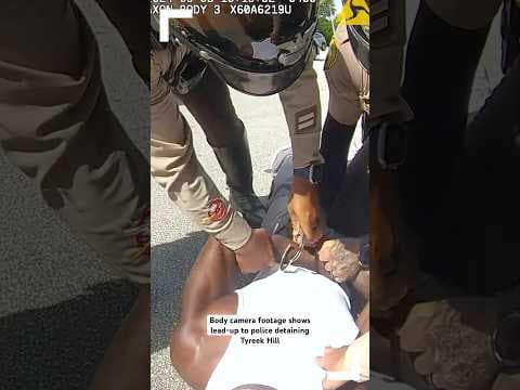 Officer tells Miami Dolphins star receiver Tyreek Hill to “stop crying” as police detain him.