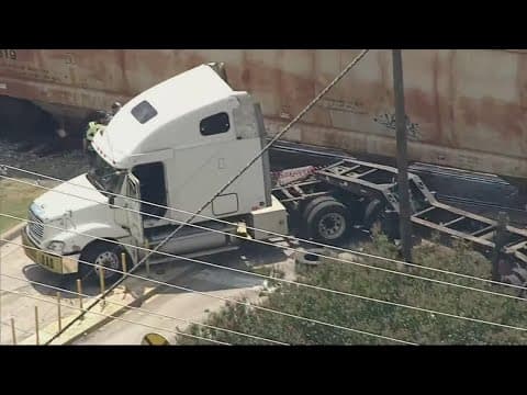 No injuries reported after a train crashed into an 18-wheeler in downtown Forney