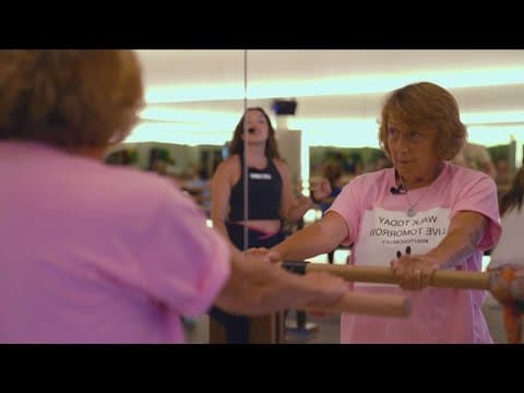 Paralyzed woman walks a mile, raises $1,000 for camper sponsorship