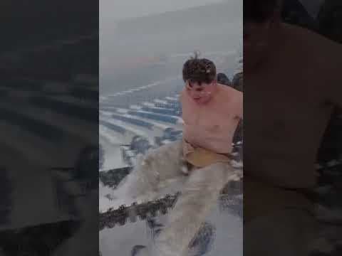 Buffalo Bills fan slides down snow-covered stairs inside stadium #shorts