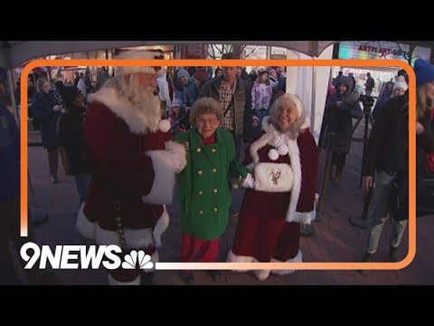 Peggy Coppom flips switch on light displays at the Pearl Street Mall
