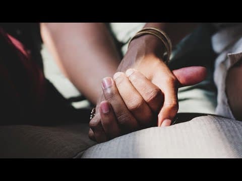 Why do humans hold hands?