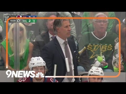 Jared Bednar lookalike sits behind him at Avalanche game