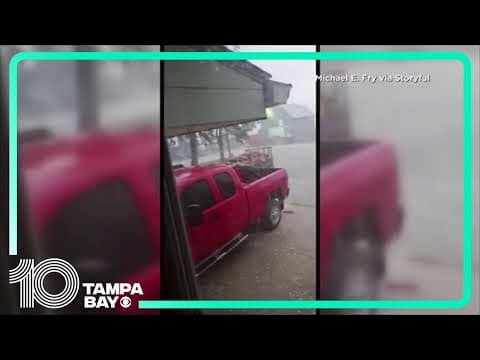 Gold ball-sized hail stones bounce in Iowa yard
