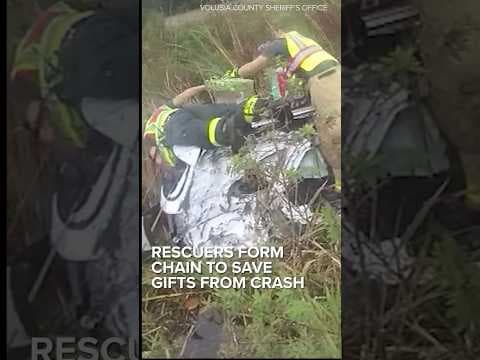 Rescuers form human chain to save gifts in car crash