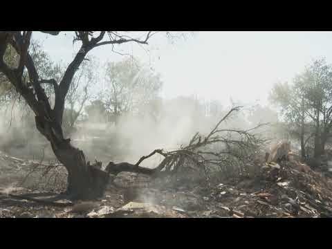 Aftermath of major wildfire on fringes of Athens as reduced winds offer respite