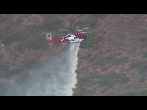 Air support and ground crews battle brush fire in Rancho Bernardo