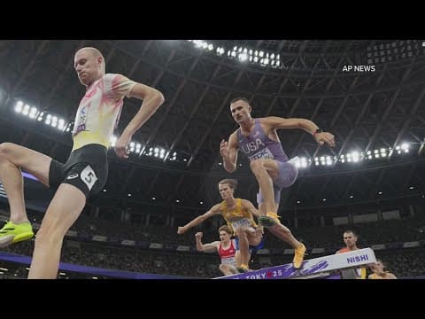 Steeplechase runner supports fellow  to cross the finish line