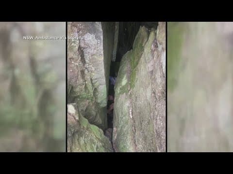 Woman gets stuck between boulders upside down for seven hours after dropping her phone