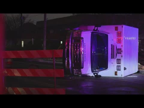 Ambulance flipped onto its side in crash on Indy's near east side