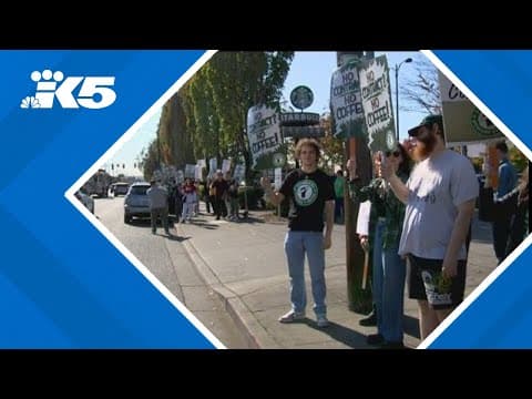 Group rallies at Starbucks headquarters after store closures and layoffs