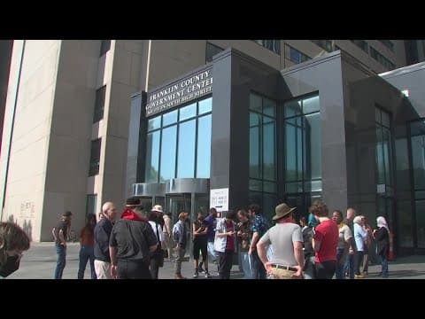 Dozens of protestors gather outside Franklin County Municipal Court after Ohio State students arrest