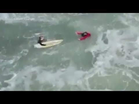 Surfer rescues three fishermen off the Jersey Shore