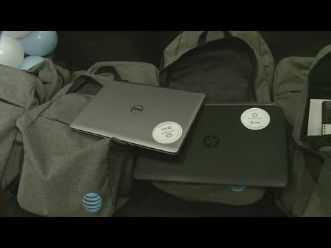 Making An Impact: Students receive laptops