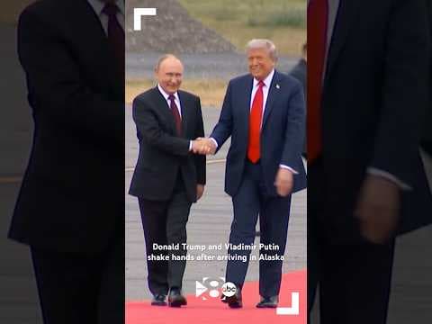 Donald Trump and Vladimir Putin shake hands after arriving in Alaska