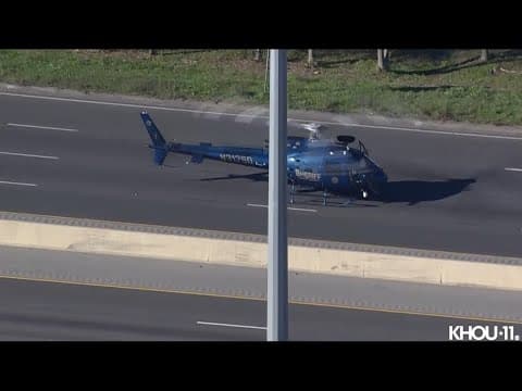 Police helicopter lands on Houston's East Freeway during standoff involving 18-wheeler