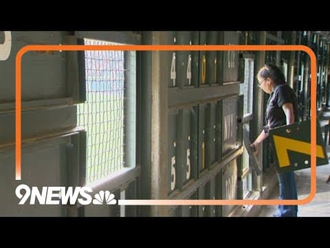 A behind the scenes look at the manual scoreboard in Coors Field