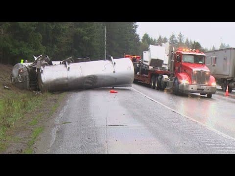 Semi hauling gasoline rolls over on I-5