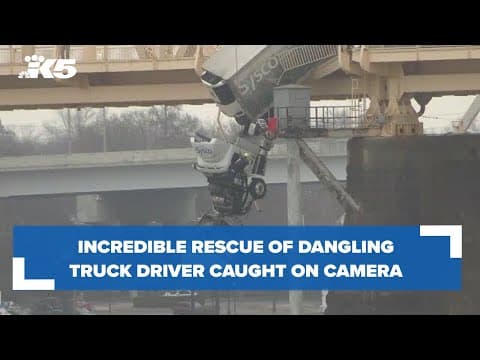 Semi-truck driver rescued while dangling off of bridge