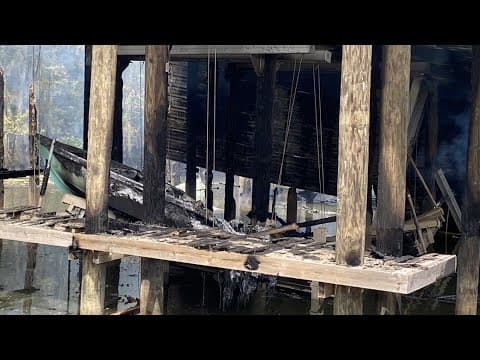 Smoldering aftermath of Covington dock fire